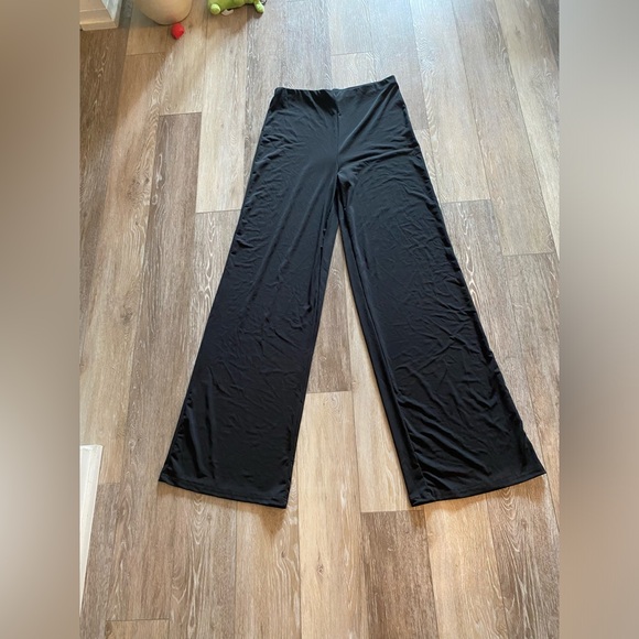 Never worn black pants. Stretchy. Flare style size M - Picture 1 of 2
